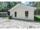 The rear exterior view displays clean white siding and well-maintained backyard space at 67 Bossie Ln., Georgetown, SC 29440