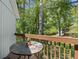 Charming outdoor balcony with railing, table, and scenic views of trees at 739 Tall Oaks Dr., Myrtle Beach, SC 29588