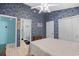 View of bedroom with blue accent wall, connecting door to bathroom, and white closet doors at 739 Tall Oaks Dr., Myrtle Beach, SC 29588
