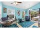 Bright dining area with large windows, fan, and sliding glass door to outdoor space at 739 Tall Oaks Dr., Myrtle Beach, SC 29588