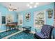 Bright dining area with ceiling fan, art and views to exterior through large windows at 739 Tall Oaks Dr., Myrtle Beach, SC 29588