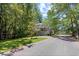 A charming two-story home nestled in a wooded area with an elevated deck at 739 Tall Oaks Dr., Myrtle Beach, SC 29588