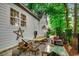 Inviting backyard patio with a hammock, seating, and beautiful landscaping provides a relaxing outdoor space at 9 Winnowing Way, Pawleys Island, SC 29585