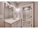 Well-lit bathroom with white vanity, modern fixtures, and a glass-enclosed shower for a clean aesthetic at 9 Winnowing Way, Pawleys Island, SC 29585