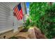 Charming home exterior with brick accents, tidy landscaping, and a welcoming entrance on a well-maintained brick path at 9 Winnowing Way, Pawleys Island, SC 29585