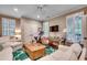 Spacious living room features neutral walls, hardwood floors, and ample seating at 9 Winnowing Way, Pawleys Island, SC 29585