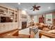 Inviting living room with a cozy fireplace, hardwood floors, and plenty of natural light at 9 Winnowing Way, Pawleys Island, SC 29585