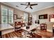 Well-organized home office with multiple workstations, built-in shelves, and ample natural light at 9 Winnowing Way, Pawleys Island, SC 29585