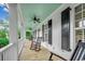 Inviting porch with rocking chairs, ceiling fans, and wood floors, perfect for relaxing outdoors at 9 Winnowing Way, Pawleys Island, SC 29585