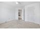Bedroom featuring carpet flooring, a ceiling fan, and white doors and trim at 914 Dock Pl., Murrells Inlet, SC 29576