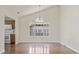 Bright dining room features hardwood floors, vaulted ceilings and oversized window at 914 Dock Pl., Murrells Inlet, SC 29576