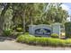 Salters Cove community sign surrounded by palm trees and foliage at 914 Dock Pl., Murrells Inlet, SC 29576