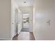 Entryway featuring hardwood floors, an open door leading to a porch, and ample natural light at 914 Dock Pl., Murrells Inlet, SC 29576