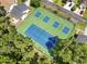Aerial view of the tennis courts in the community among trees and a building at 914 Dock Pl., Murrells Inlet, SC 29576
