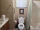 Accessible bathroom featuring a toilet, vanity, grab bars and a shower with curtain at 1025 W Plantation Dr. W # 2817, Little River, SC 29566