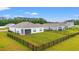 Aerial view of a fenced-in backyard with green lawn in a residential community at 1031 Corn Husk Loop, Conway, SC 29527