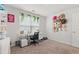 Bright bedroom featuring a desk, window with plants, and an eclectic hat collection at 1031 Corn Husk Loop, Conway, SC 29527