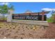 Attractive Harvest Ridge community sign surrounded by colorful landscaping and greenery at 1031 Corn Husk Loop, Conway, SC 29527