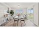 Bright dining area with glass-top table, modern chairs, and sliding glass door at 1031 Corn Husk Loop, Conway, SC 29527