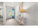 Inviting entryway with wood floors, decorative console table, and bright blue front door at 1031 Corn Husk Loop, Conway, SC 29527
