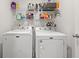 Laundry room featuring a Maytag washer and dryer with shelving above for storage at 1031 Corn Husk Loop, Conway, SC 29527