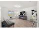 Bright living room with gray sofa, TV and contemporary decorations at 1031 Corn Husk Loop, Conway, SC 29527