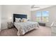 Inviting main bedroom featuring a patterned bedspread, ceiling fan, and natural light at 1031 Corn Husk Loop, Conway, SC 29527