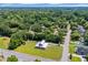 Aerial shot of the red home with lush trees and neighborhood nearby at 1039 Forest Dr., Conway, SC 29526