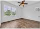 Bright bedroom with large windows, ceiling fan, and modern vinyl flooring at 1039 Forest Dr., Conway, SC 29526