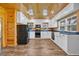 Modern kitchen featuring white cabinetry, dark countertops, and stainless steel appliances at 1039 Forest Dr., Conway, SC 29526