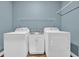 Laundry room featuring a wash basin, washer, dryer, and wire shelving at 1039 Forest Dr., Conway, SC 29526