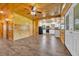 Living area with wood paneling that transitions into a modern kitchen space at 1039 Forest Dr., Conway, SC 29526