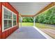 Covered patio provides an outdoor view of the manicured backyard at 1039 Forest Dr., Conway, SC 29526