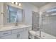 Modern bathroom featuring tile flooring, white vanity, framed mirror, and glass door shower at 1095 Laconic Dr., Myrtle Beach, SC 29588