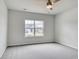 Comfortable bedroom with natural light, ceiling fan, and neutral tones, providing a calming and relaxing space at 1095 Laconic Dr., Myrtle Beach, SC 29588