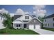 Charming two-story home with stone accents, attached two-car garage, and manicured lawn at 1095 Laconic Dr., Myrtle Beach, SC 29588