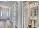 Bright entryway showcasing wood flooring, archways, and open access to the powder room at 1095 Laconic Dr., Myrtle Beach, SC 29588
