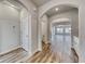 Inviting foyer features an arched entryway, wood flooring, and neutral paint, showcasing a bright, open floor plan at 1095 Laconic Dr., Myrtle Beach, SC 29588