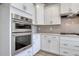 Kitchen with stainless steel double ovens and custom cabinets at 1095 Laconic Dr., Myrtle Beach, SC 29588