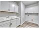Bright laundry room with modern sink and cabinetry at 1095 Laconic Dr., Myrtle Beach, SC 29588