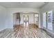 Open-concept living area with arched entryway and staircase at 1095 Laconic Dr., Myrtle Beach, SC 29588