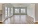 Spacious living room with ample sunlight and wood-look floors at 1095 Laconic Dr., Myrtle Beach, SC 29588
