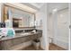 Well lit bathroom featuring granite countertops and a shower with curtain at 1105 S Ocean Blvd. # 520, Myrtle Beach, SC 29577