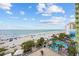 Gorgeous beach view shows a sandy beach, clear blue water, and an outdoor pool at 1105 S Ocean Blvd. # 520, Myrtle Beach, SC 29577