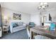 Comfortable living room with a sofa, patterned chairs, dining table, and stylish decor at 1105 S Ocean Blvd. # 520, Myrtle Beach, SC 29577
