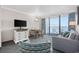 Comfortable living room with a sofa, patterned chairs, table, and a balcony overlooking the ocean at 1105 S Ocean Blvd. # 520, Myrtle Beach, SC 29577