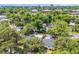 Aerial view of neighborhood with mature trees, blue house, and downtown skyline at 1155 Palmetto St., Georgetown, SC 29440