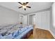 Large, bright bedroom with closet and hallway access; hardwood floors and a ceiling fan add to the appeal at 1155 Palmetto St., Georgetown, SC 29440