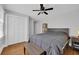Well-lit bedroom with neutral paint, wood floors, large bed and an ample closet for storage at 1155 Palmetto St., Georgetown, SC 29440