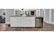 Kitchen island featuring white cabinets, stainless steel appliances, and a granite countertop at 1155 Palmetto St., Georgetown, SC 29440